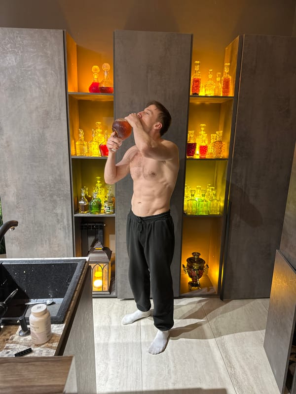 Man drinks from bottle in Kursk kitchen