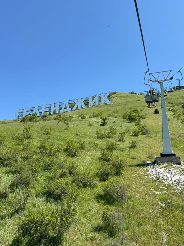 Chairlift ride documented across green hillsides in Gelendzhik, Russia