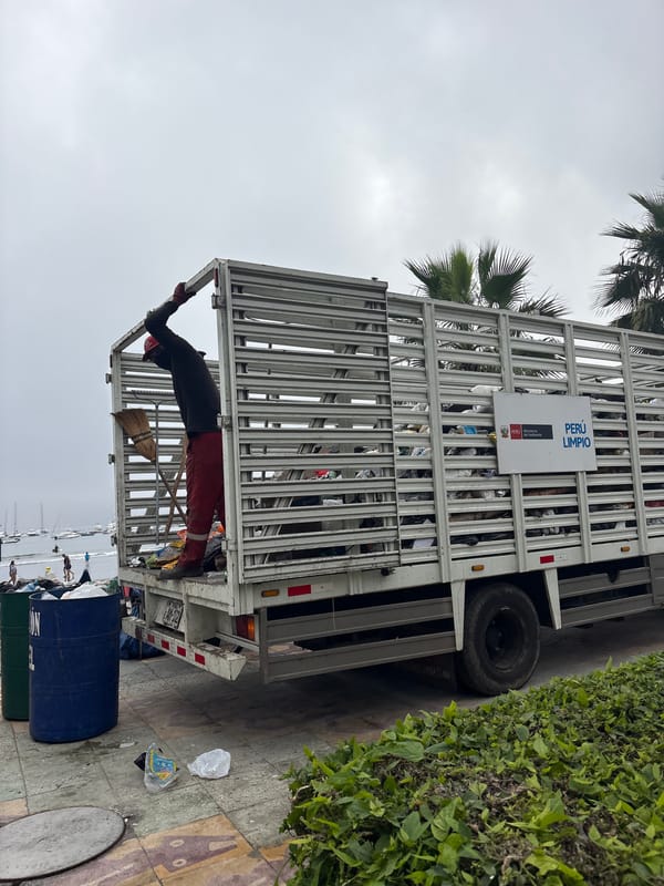 Waste truck conducts collection operations in Ancón, Peru