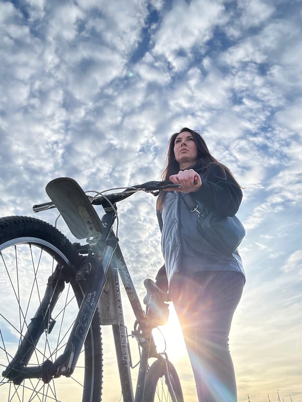 Woman cycling and driving around Chaikovsky, Russia documented