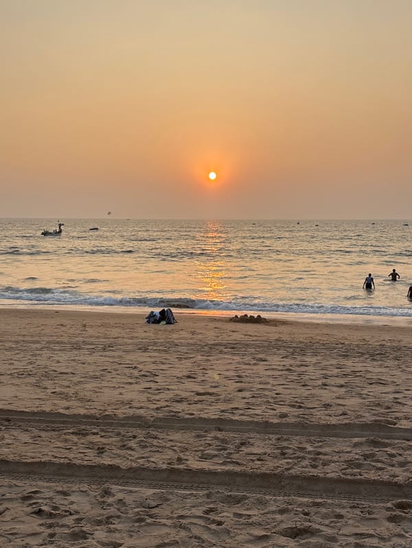Beachgoers capture sunset moments along Indian coastline