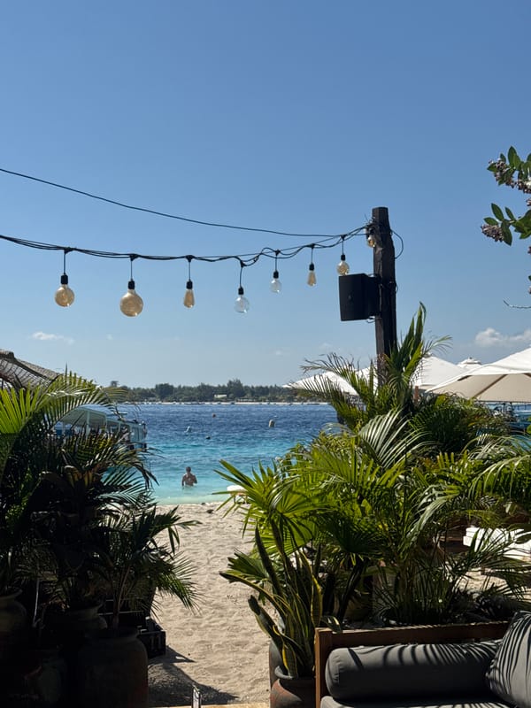 Lazy beach day along Lombok's coastline — dining, stalls, and details
