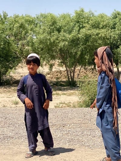 School children spotted during morning routines in Afghan villages