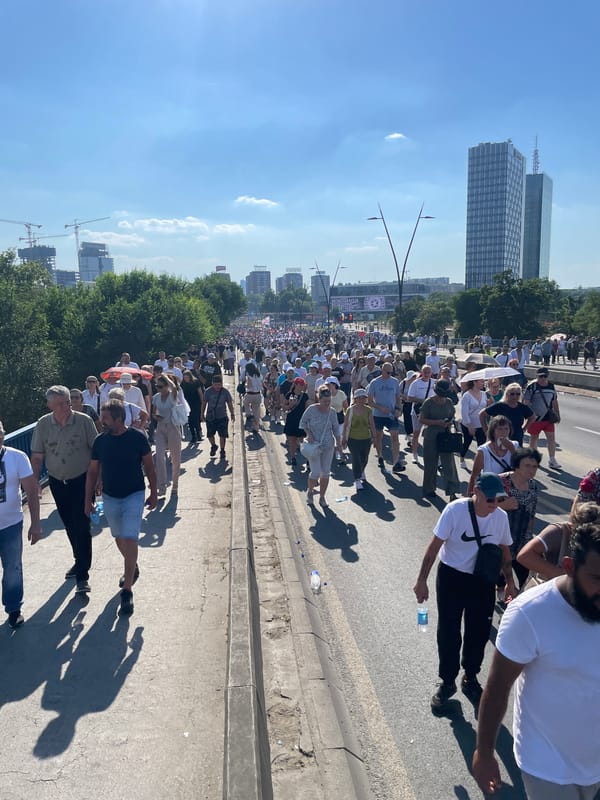 Mass procession with Serbian flags moves through central Belgrade