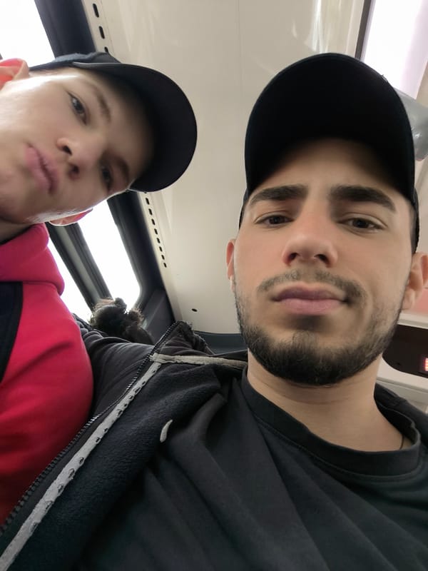 Two men take selfie on public transport in Strasbourg