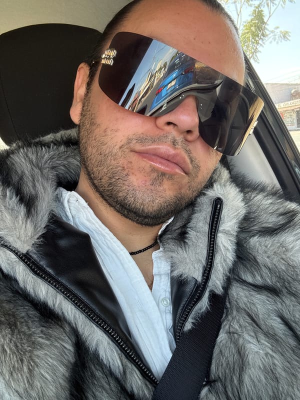 Man in fur coat and sunglasses spotted in car