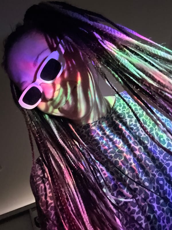 Person photographed under colorful lights in Rusanovo, Russia