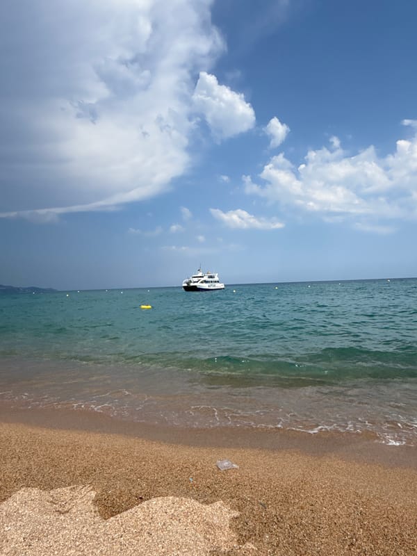 Sun, boats, and beach chaos on a summer afternoon in Blanes