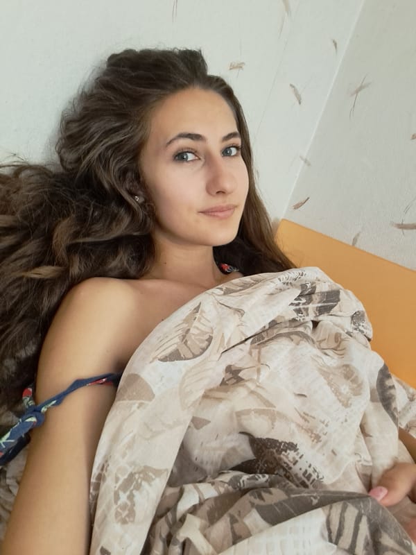 Lazy morning in a Chepintsi bedroom, with a nature painting nearby
