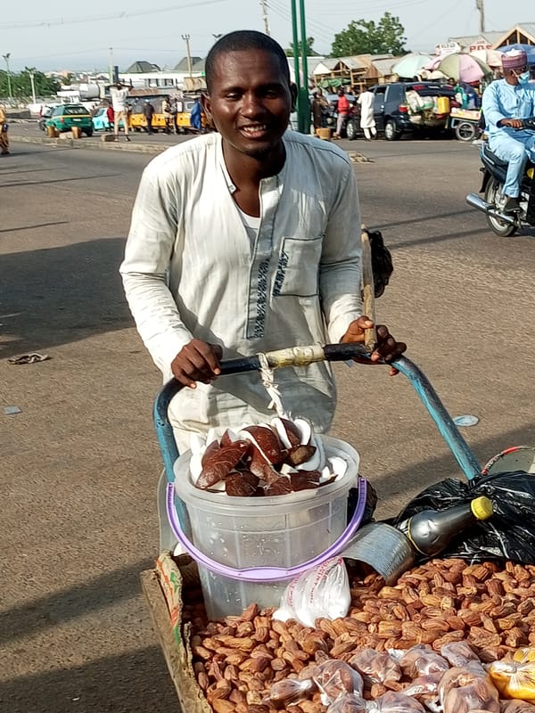 Street vendors and daily commerce moving through Gombe, Nigeria