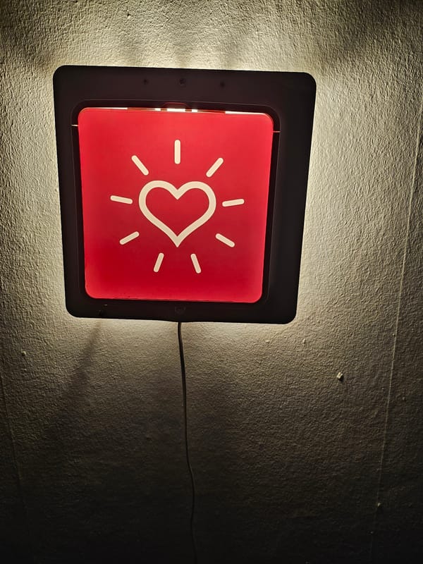 Indoor scenes captured in Trier: decorative lighting and child watching TV