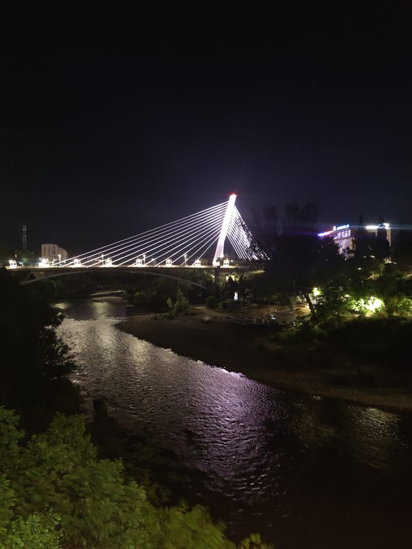 Podgorica's Millennium Bridge glowing after dark