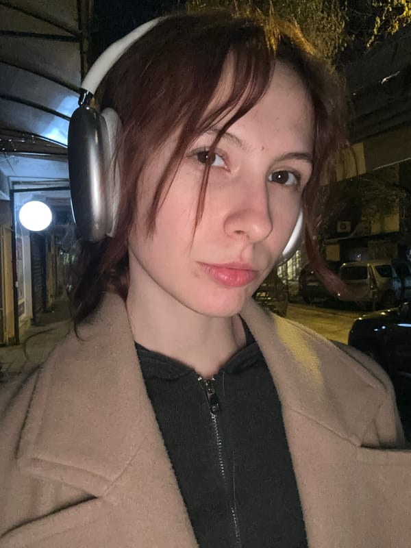 Woman takes selfie wearing AirPods Max in Novi Sad