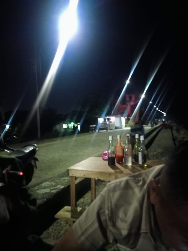 Evening coastal dining scene documented in Lhokseumawe, Indonesia
