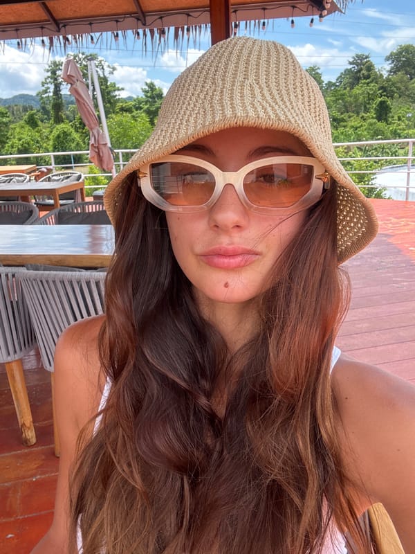 Woman photographed at outdoor restaurant in Kathu, Thailand