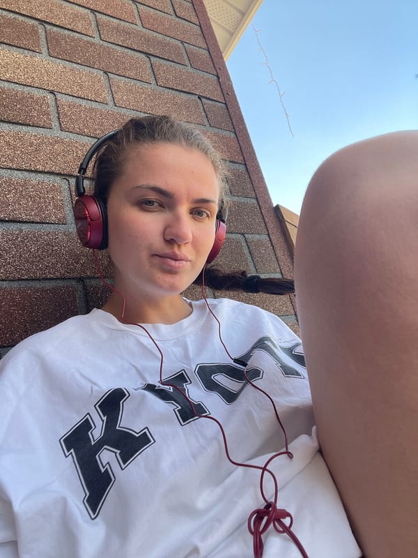 Woman relaxes with headphones on Moscow-area rooftops and decking