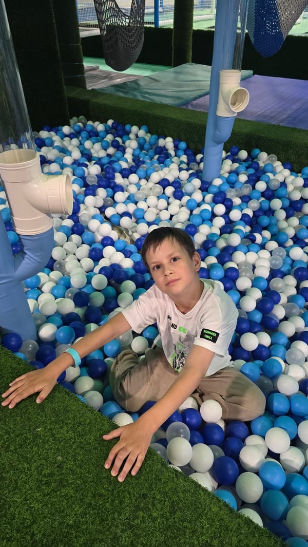 Child enjoys afternoon playtime at indoor facility in Izhevsk