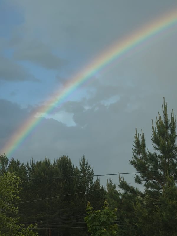 Double rainbow appears over Markovo, Russia during afternoon hours