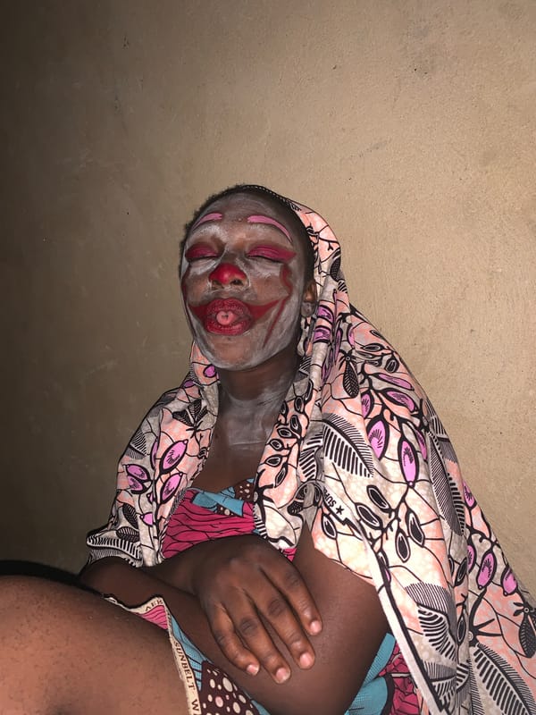Clown performer documented in multiple poses in Agban, Nigeria
