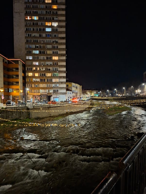 Evening documentation captures Gabrovo's lit waterfront and architectural details