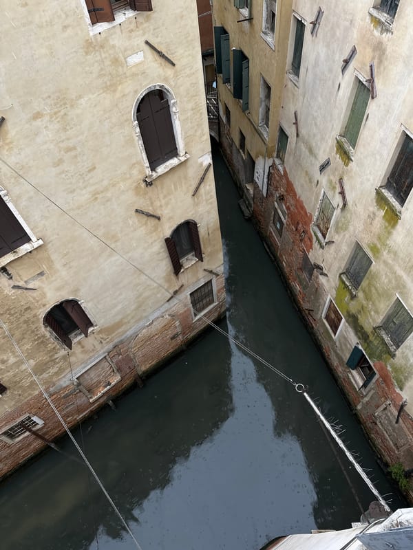 Venice canal scene documented amid weathered historic buildings