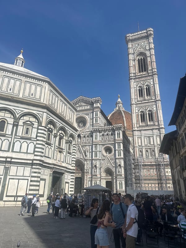 Tourist visits Florence's Duomo complex on sunny Friday afternoon
