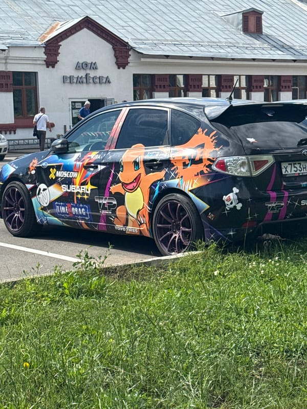 Moscow comic and collectibles shop, plus a cartoon-wrapped Subaru outside