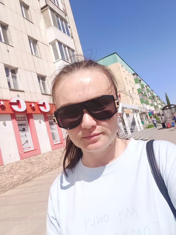 Woman takes selfie on street in Ufa, Russia