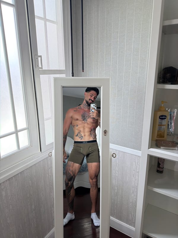 Man takes mirror selfie indoors in Chalong, Thailand