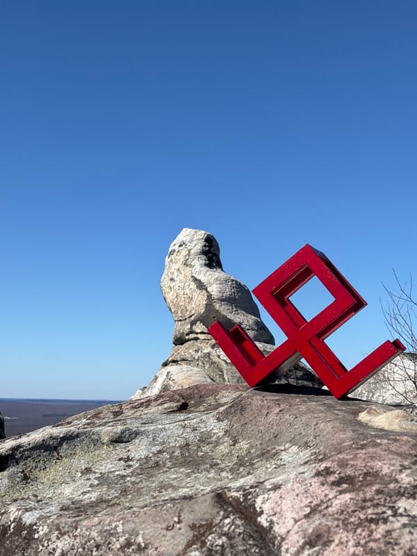 Two monuments captured on rocky terrain in Gubakha