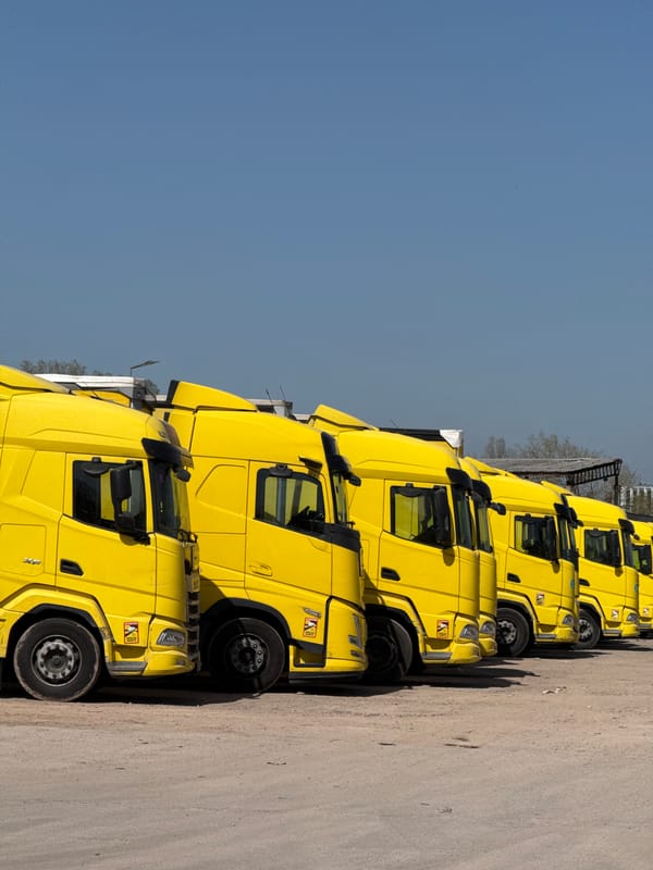 Yellow semi-trucks lined up in Busmantsi, Bulgaria