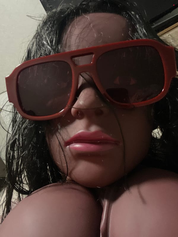 Styled mannequin heads with sunglasses in a casual still-life setup