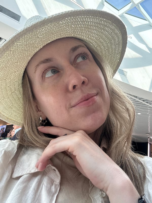 Selfie moment under geometric skylight at Fiumicino Airport