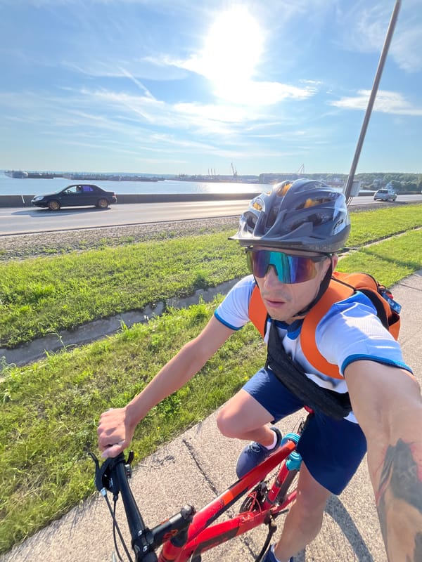 Red bicycle ride through Chaikovsky on a sunny summer day