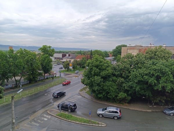 Wet streets, four vehicles at Karnobat intersection after rain