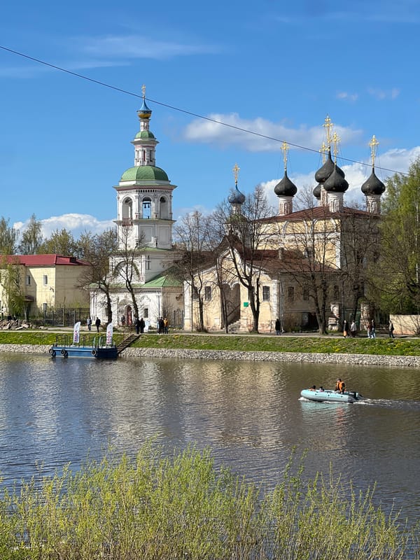 River scenes captured in Vologda featuring churches and bridge