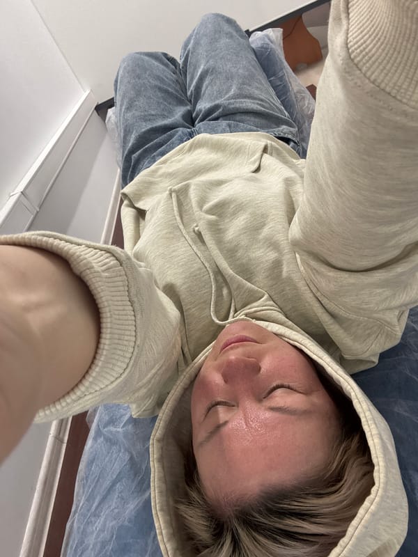 Person photographed resting in overhead selfie in Chaikovsky, Russia