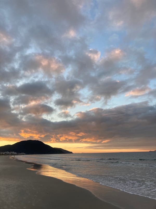 Golden hour clouds over a Florianópolis beach