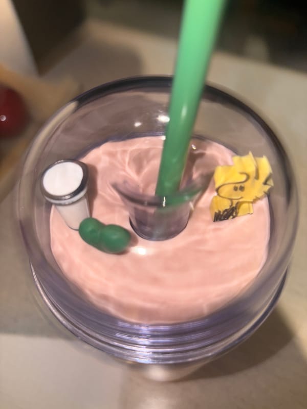 Morning floral arrangement and pink beverage documented in Puebla