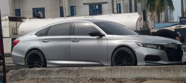 Silver Honda parked with open trunk in Alaiyabiagba, Nigeria