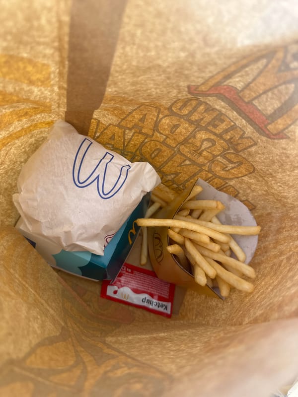 McDonald's meal unpacked at outdoor terrace in Alicante