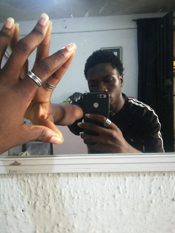 Lagos resident documents barbershop visit through selfies and photos