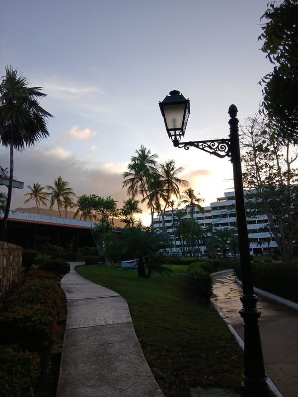 Evening documentation captures tropical resort scenes at Venezuelan beach