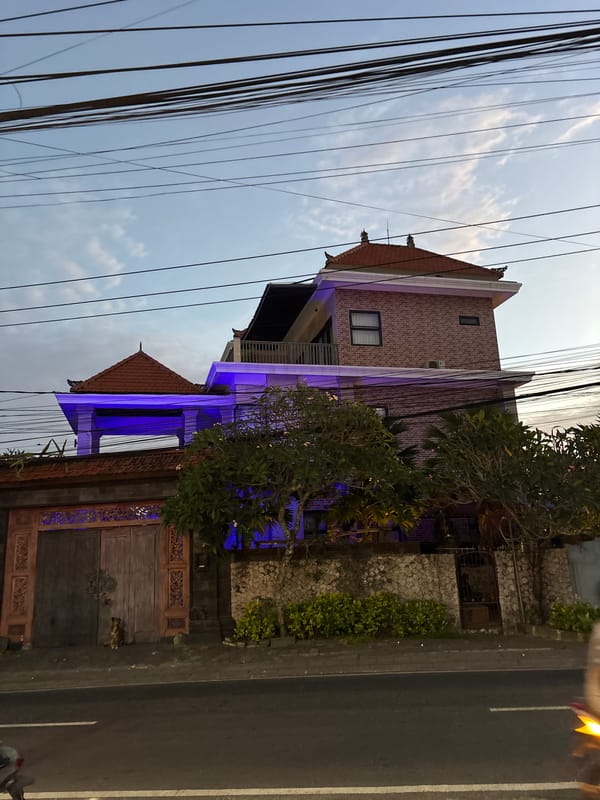 Blue-lit brick building observed in Kuta Selatan, Indonesia