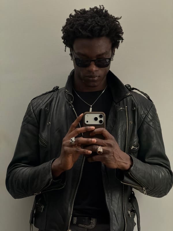 Man photographs himself with smartphone in London morning