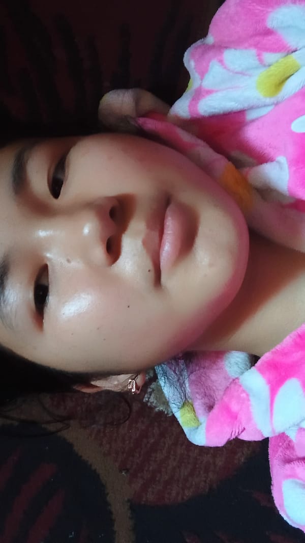 Late-night selfie session with a flip phone in Uchkun