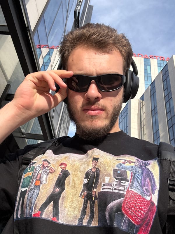 Man with sunglasses and headphones captured in close-up photograph