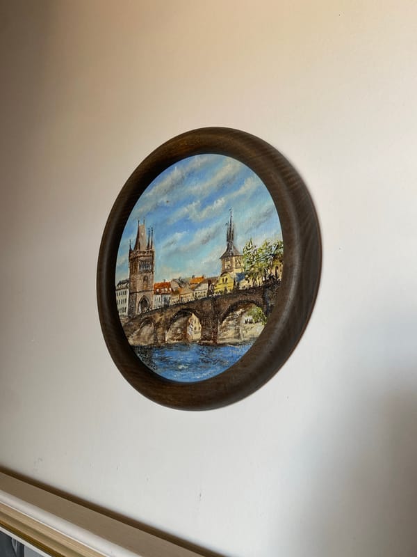 Inside a cozy Czech home studio packed with small paintings and cats