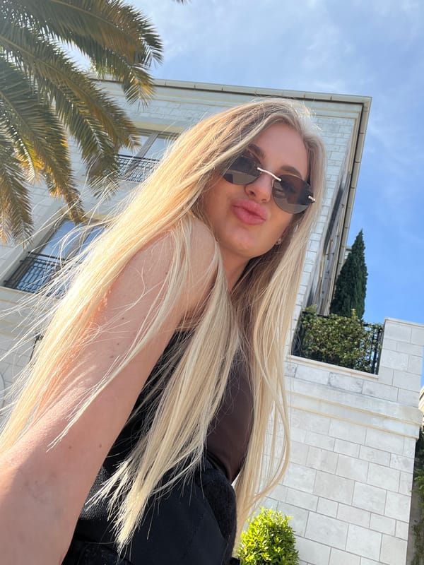 Woman poses for photos in Tivat marina district