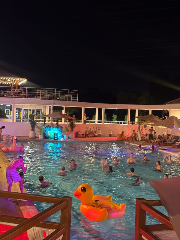 Nighttime pool gathering at Kale Pool Club in Kathu